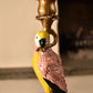 Decorative parrot figure on a candlestick